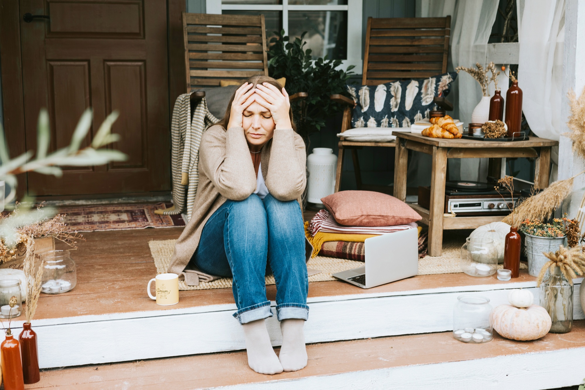 Ketamine uses for Mental health - sad woman sitting on porch